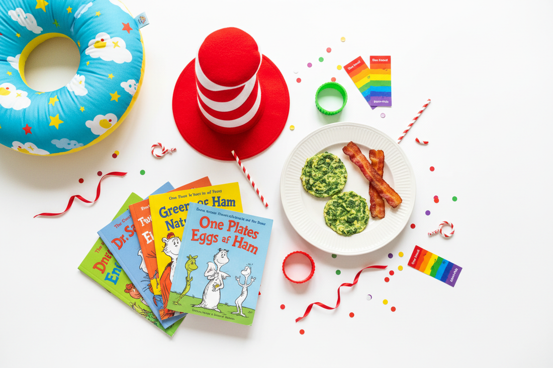Flat lay of Dr. Seuss Day celebration with green eggs, red and white striped Cat in the Hat hat, books and rainbow bookmarks for Read Across America